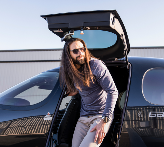 An image of a man exiting a VisionJet